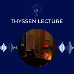 Photograph of Gudrun Krämer, standing at the podium in the conference room at the GHIL. On a blue background, with the GHIL podcast logo of microphone and headphones in a circle.