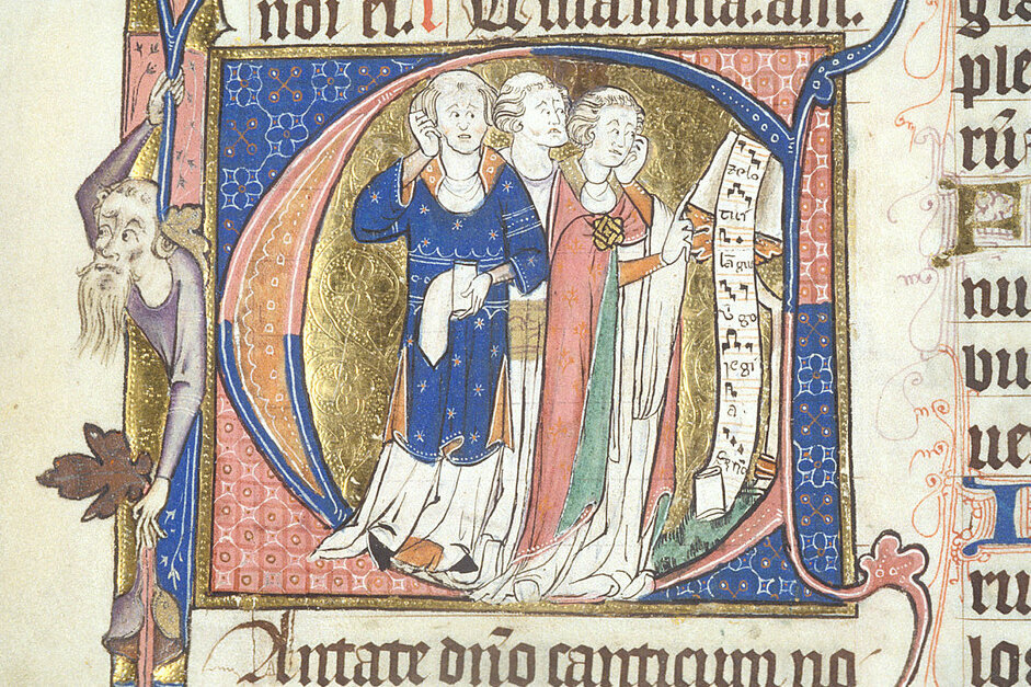 Manuscript initial of the letter C. Within the letter can be seen three clerics with tonsures, singing the motet Zelo tui langueo from a scroll of music at a lectern. The chief colours of the illumination are red and blue, with gold and green also featuring in the robes and the background.