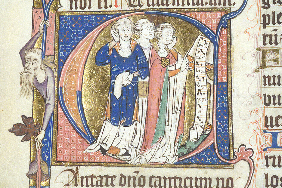 Manuscript initial of the letter C. Within the letter can be seen three clerics with tonsures, singing the motet Zelo tui langueo from a scroll of music at a lectern. The chief colours of the illumination are red and blue, with gold and green also featuring in the robes and the background.