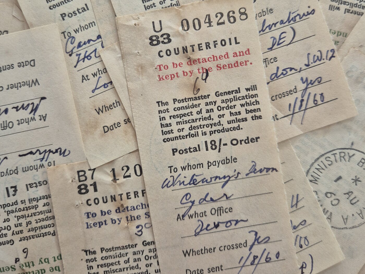 Image of a pile of postal order counterfoils, dating from 1960, from the collections of PRAAD Accra, RG 17/1/220