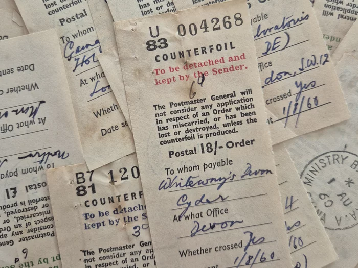 Image of a pile of postal order counterfoils, dating from 1960, from the collections of PRAAD Accra, RG 17/1/220