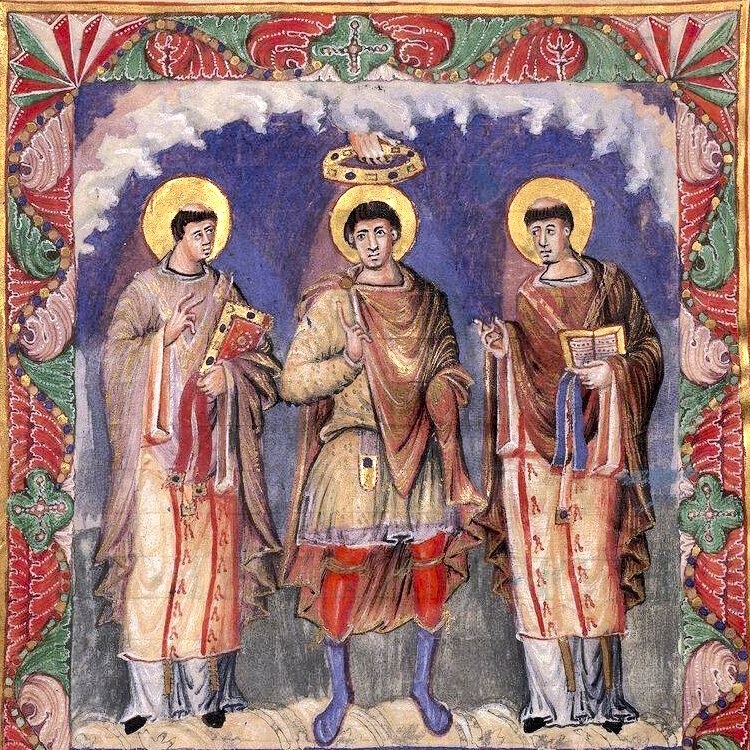 An illuminated image from the Sacramentarium of Charles the Bald, showing a group of three men, one of whom is being crowned by a hand that is descending from Heaven.