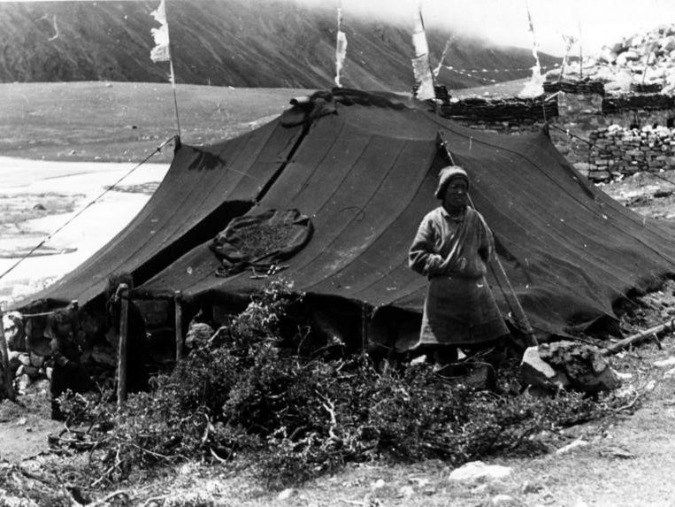 Tibetan nomad in front of tent A Tibetan nomad in front of his tent