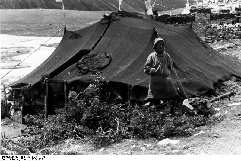Tibetan nomad in front of tent A Tibetan nomad in front of his tent