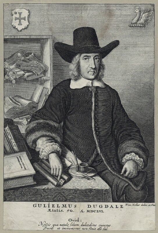 Etching of Sir William Dugdale, by Wenceslaus Hollar, 1656. The image shows Dugdale seated, with a desk covered with books and scrolls to his right. His hand rests lightly on a scroll, which sits next to an inkwell. He is wearing a coat with large fur cuffs. His white shirt collar and the ruffs at the ends of his sleeves are visible. He has on his head a large hat. Behind him on his right side are shelves with more scrolls.